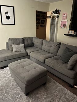 Gray Tufted Sectional Sofa with Ottoman