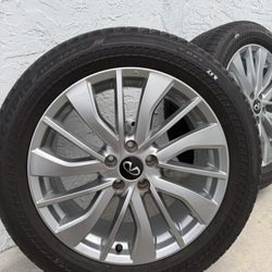 This is a 19-inch Infiniti QX50 alloy wheel with a Bridgestone Ecopia H/L 422 Plus tire