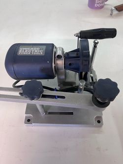 Saw blade sharpener. Like new, used once. Comes with sharpening wheels a stuff.