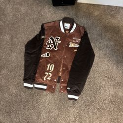 Nike brown and gold varsity jacket