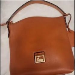 Dooney & Bourke pebble  leather purse with thick strap purse  First picture shows the exact color