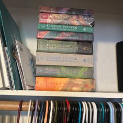 Hard back seven books series of Harry Potter and Dumbledore’s wand