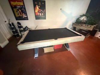 Pool table, 2 sets of pool balls, pool stick holder and 5 pool sticks