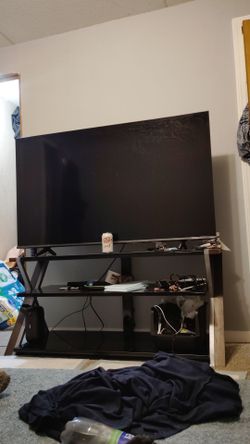 55 inch  Roku Smart TV and glass tv stand