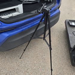 black tripod stand designed to hold smartphones