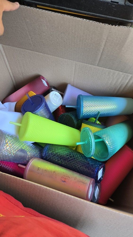 STARBUCKS CUP. A LOT OF THEM