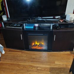MUST TO GO!! TV stand with heater and fireplace display