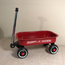 Radio Flyer wagon - approx 14 1/4”  X  7 1/4” wide 5 1/2” high ( wagon bed measurement only)