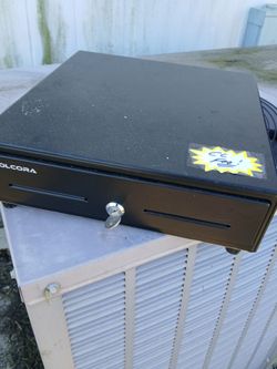 Spring loaded money box with key