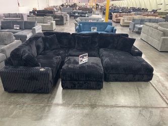 Black Sectional + Ottoman  Soft fur like corduroy fabric