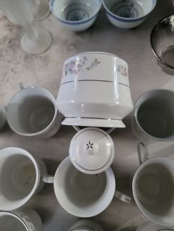 12 cups  1 Creamer Holder 1 Suger Holder $ 100.00