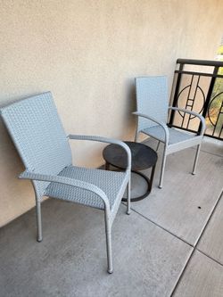 2 stackable resin wicker patio chairs with cover