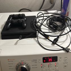 PS4 With The Controller And Cables