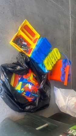 Lot of hot wheels and lot of multiple sets of track builders tracks.