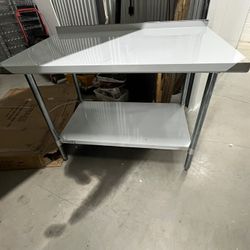 Stainless Steel Work Table 48"W X 30"D X 35"H with 2” backsplash  