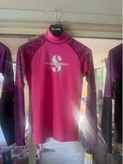 Special price, brand new. Scubapro sun protection top (UPF 50 rash guard, long sleeve, women's), size 4 (Small).