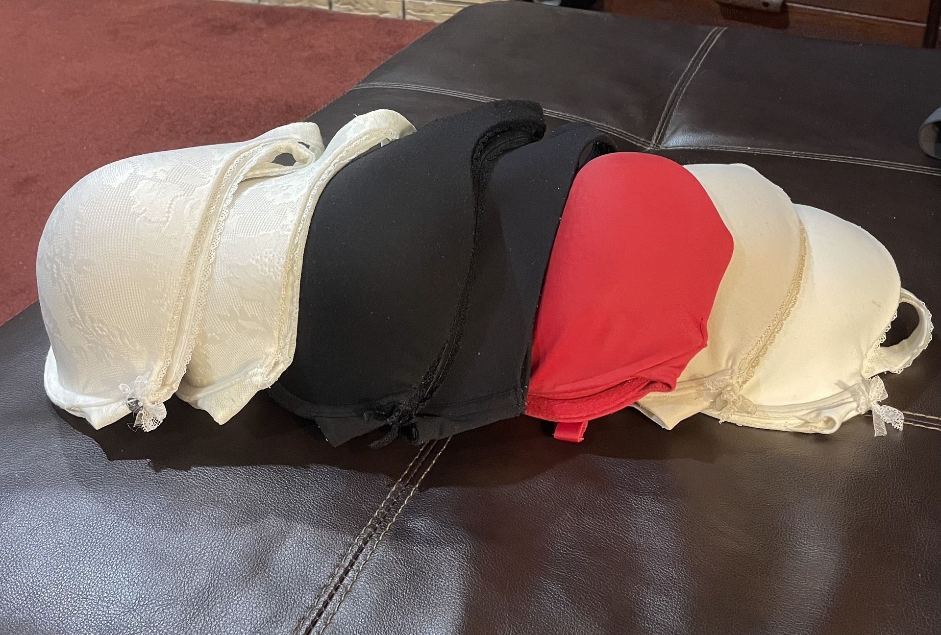 Set of Victoria Secret Bras. Body by Victoria. All For $50. Richmond 77406. Pecan Grove 1-36D cream lace 2-38D cream and black 3-38DD cream, lace, red