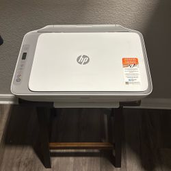 white HP DeskJet 2755e All-in-One Printer.