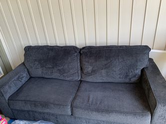Slate gray sofa with pillows