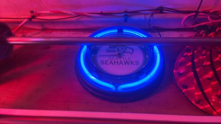 Glass tube Seahawks wall clock