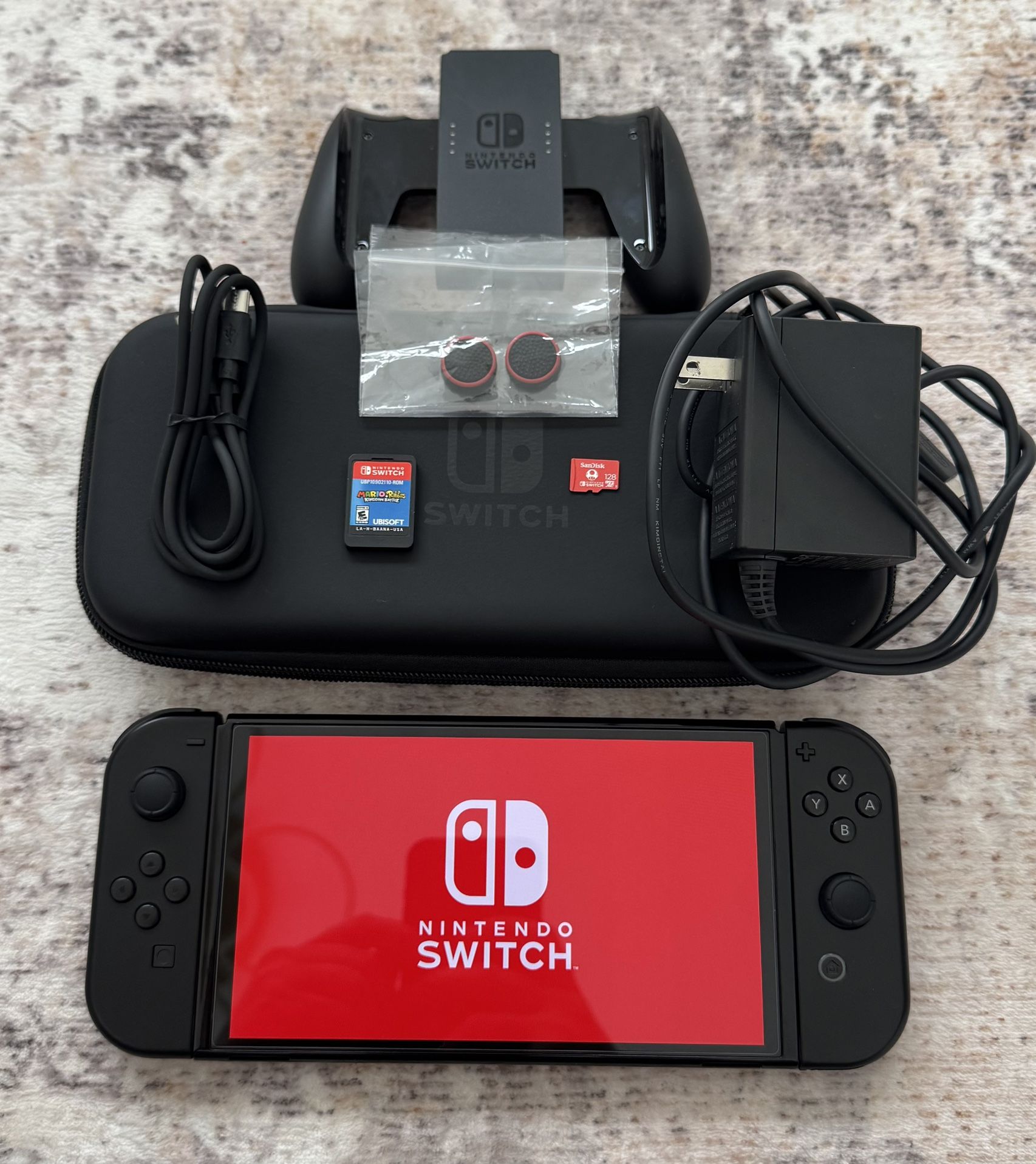 Nintendo Switch OLED + Mario Rabbids + 128GB SD CARD + OEM Black Joycons +Extras
