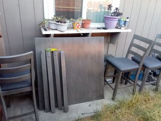 Gray solid wood table and chairs