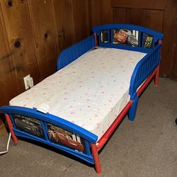 Disney Delta Children Disney/Pixar Cars Plastic Toddler Bed, with Mattress
