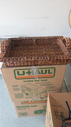 Large brown wicker serving basket