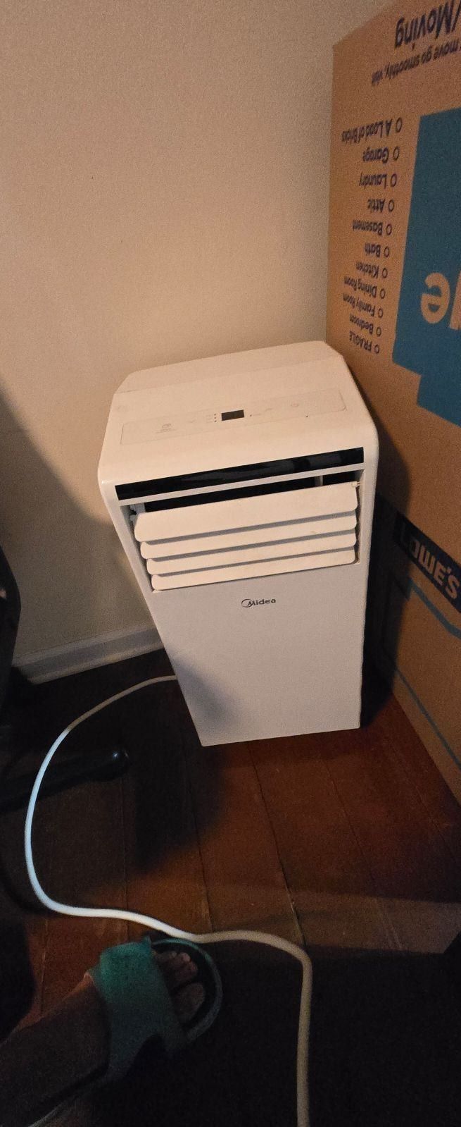 Indoor AC Unit with hose.