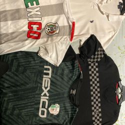 black Pavini V-neck t-shirt with a checkered pattern and red trim, U.S. POLO ASSN. White Collared Shirt, Mexico Jersey/not real ones