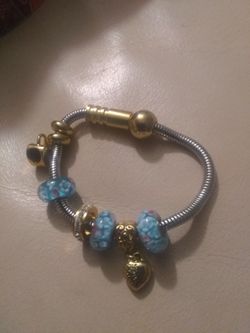 Beautiful 💗 brand new sterling steel 14 kt gold. Bronze bracelet.