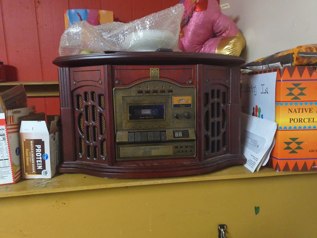Has A Record Player A CD Player And A Cassette Player