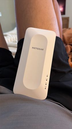 Netgear EAX 12 network extender.