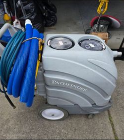 Portable carpet cleaner with rotary extractor..