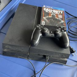 PS4 With Wireless Controller And A Game 