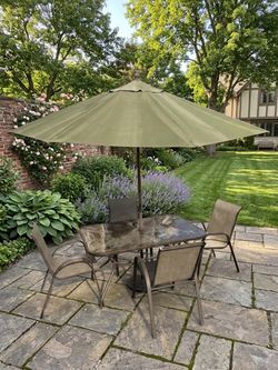Used patio table, chairs and umbrella $50