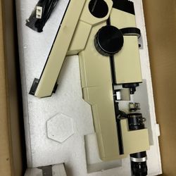 Topcon microscope in original packaging.