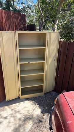Metal cabinet made in USA. 5 ft tall, 2 ft wide 1 ft deep