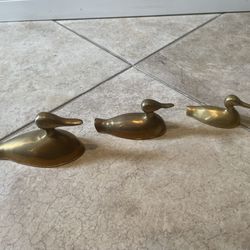 3 different size vintage brass duck figurine.