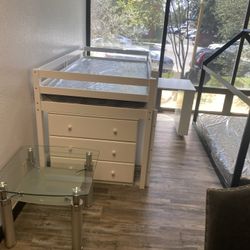 Twin loft bed with desk, bookcase & chest. Available in white & grey. Assembly required. Assembly not included tax included. Free local delivery.   $4