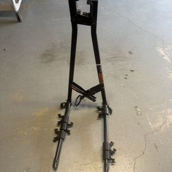 CURT heavy-duty three-bike carrier in good used condition. Holds up to 3 bicycles and folds down for easier storage