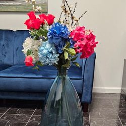 Blue Glass Vase With Flower Arrangement 