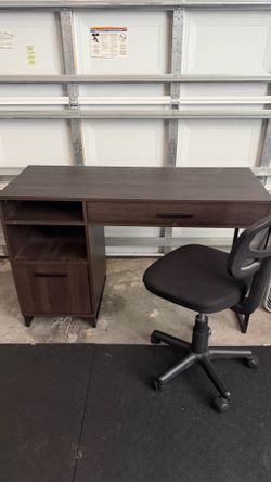 Dark brown wood desk with chair