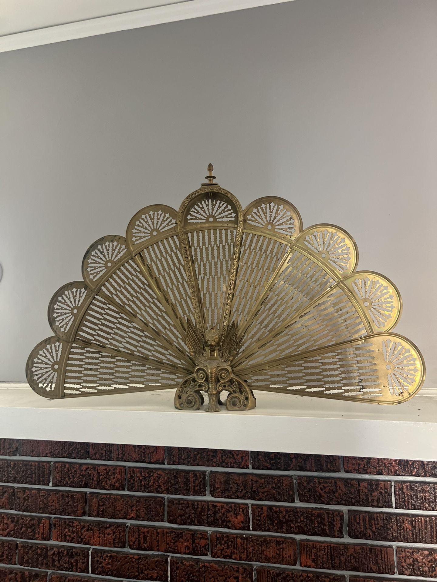 vintage brass- peacock fire screen