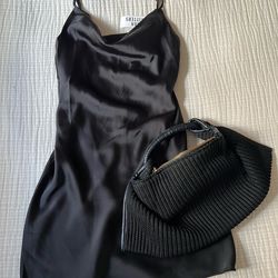 Chic black satin dress with a cowl neckline