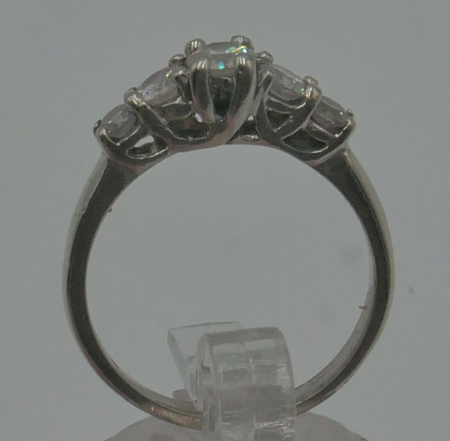 14KT WHITE GOLD ANNIVERSARY BAND SIZE 7.5 3.8 GRAMS WITH 5 DIAMONDS APPROXIMATE CENTER ROUND DIAMOND 0.30 0.35PTS SI2 H; 2 SIDE DIAMONDS 0.16 0.18