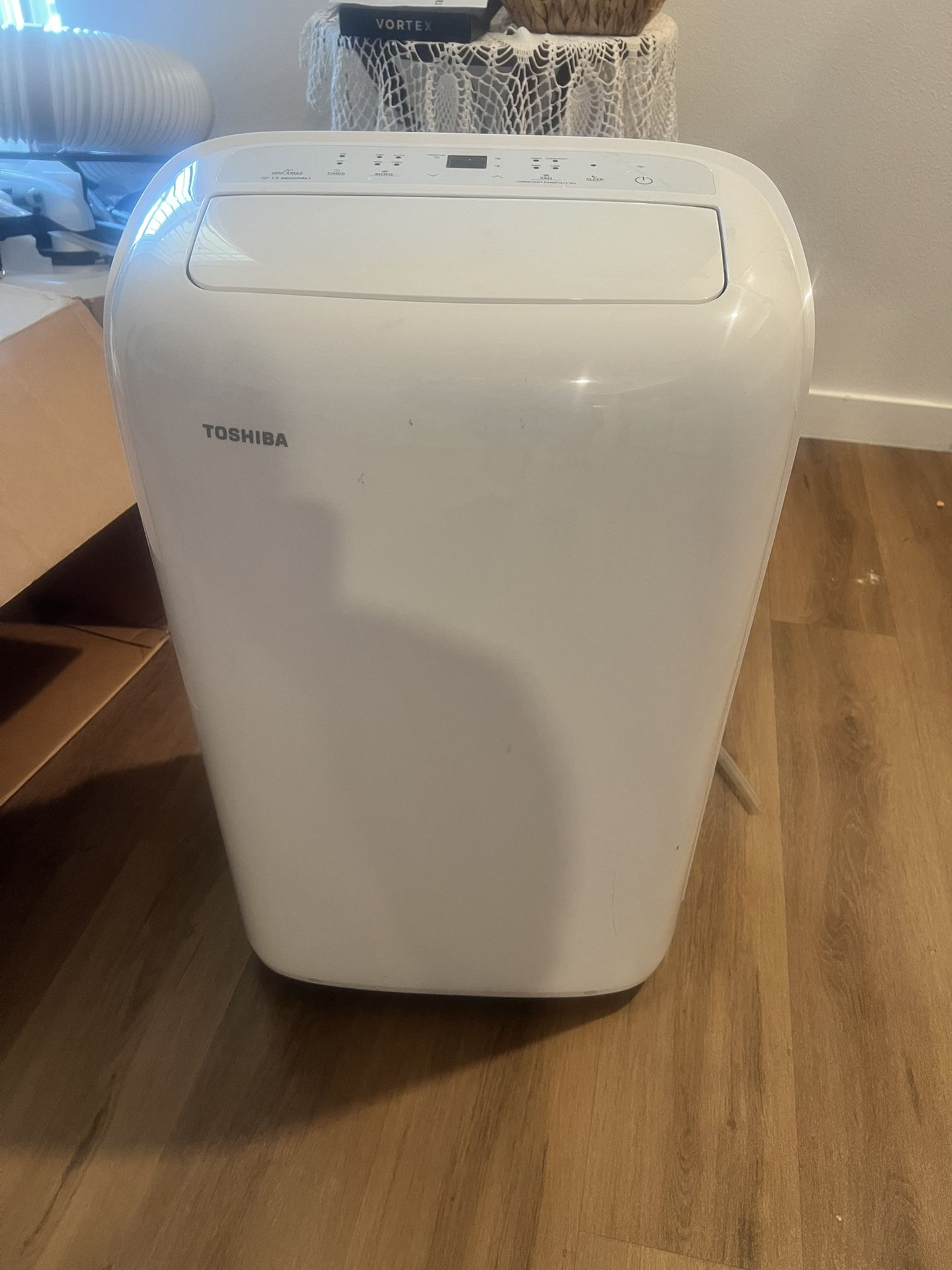 Toshiba  BTU/h 12000 Portable Air Conditioner Cools 350 Sq. Ft. with Dehumidifier and Remote in White