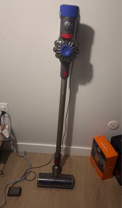 Dyson Vaccum with charger and adapter heads