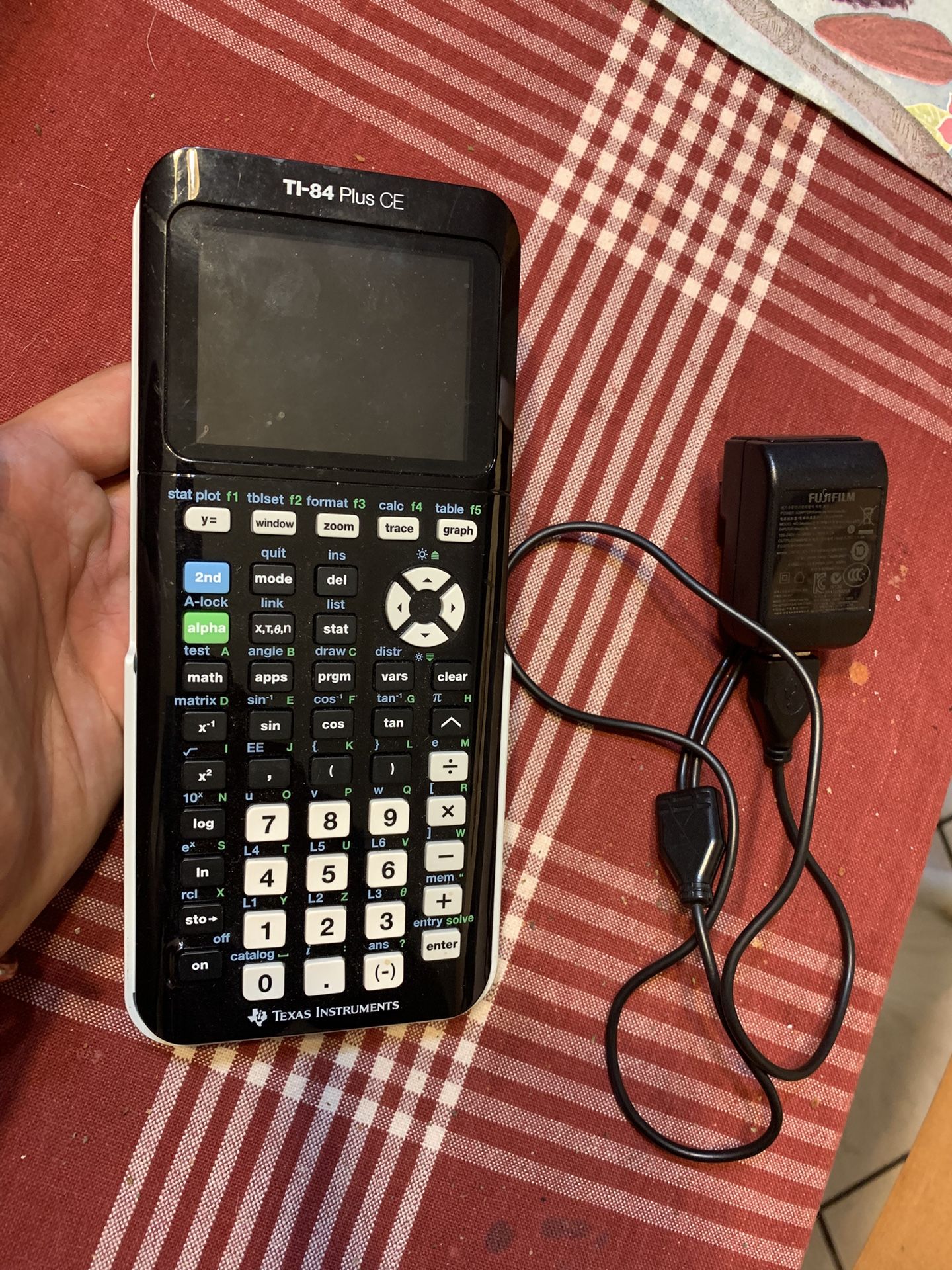 Texas Instrument Ti-84 Plus CE Graphing Calculator With Sleeve And Charger Cable