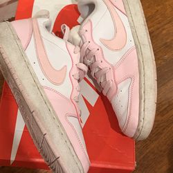 Nike Dunk Low sneakers, in a pink and white colorway or Arctic Pink or Rose/White.